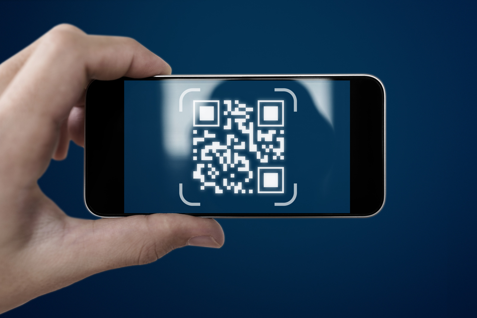 QR code scanning payment and verification. Hand using mobile smart phone scan QR code